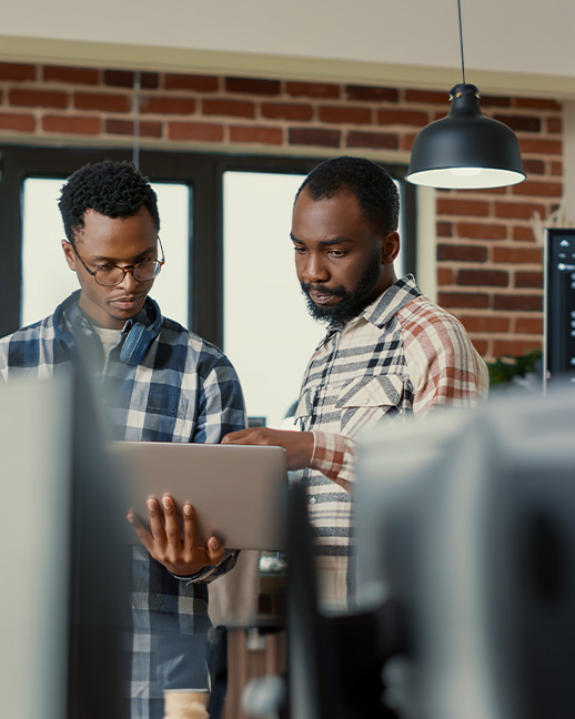 men having a conversation featuring laptop